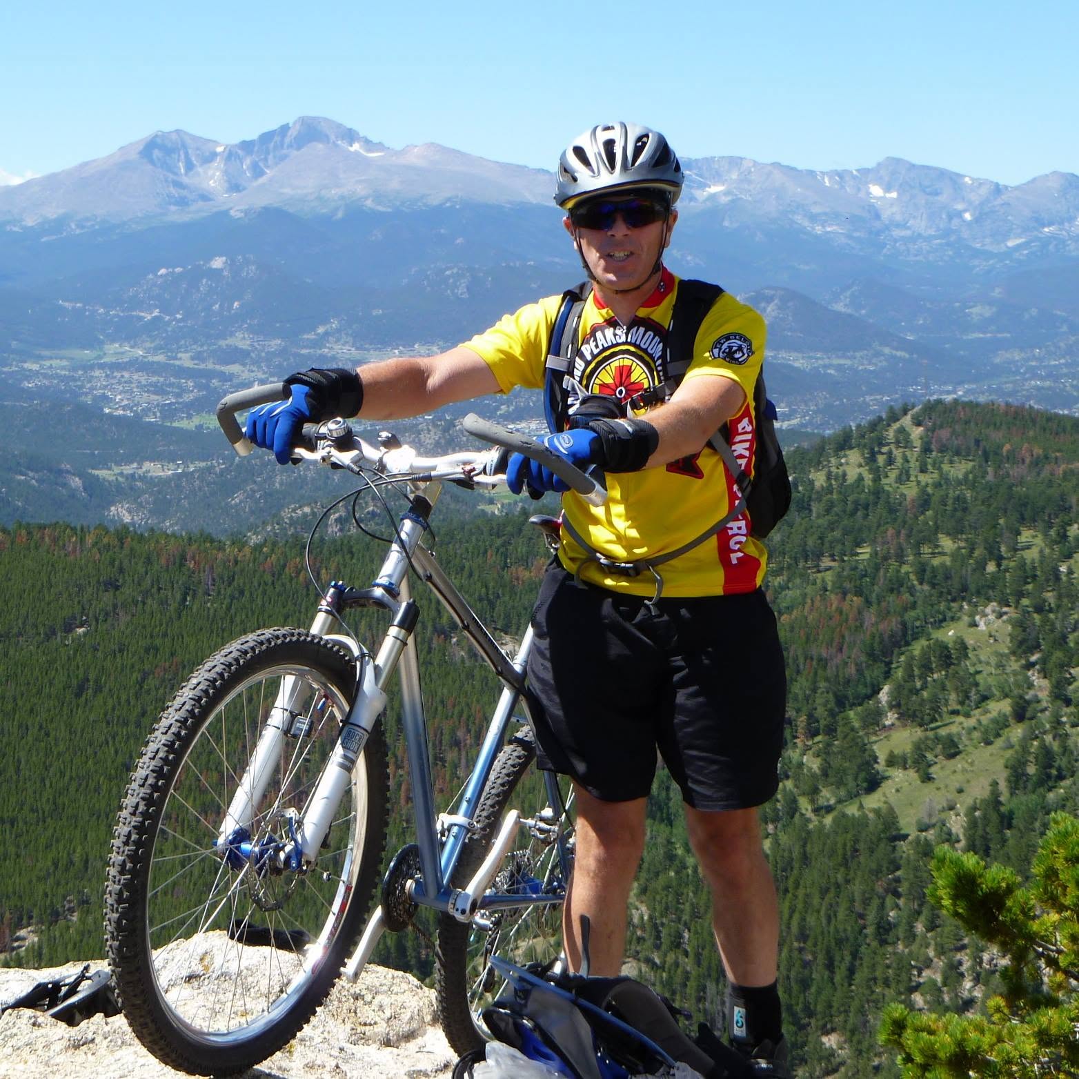 Pete with his mountain bike overlooking the mountains